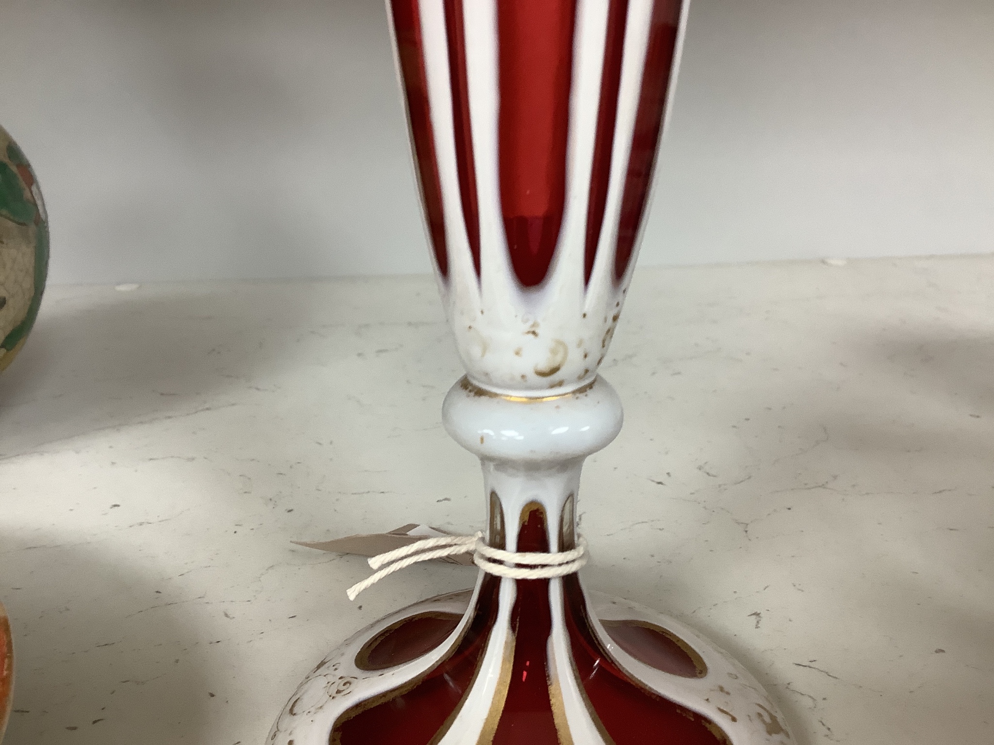 A Bohemian overlaid ruby glass vase, 31cm